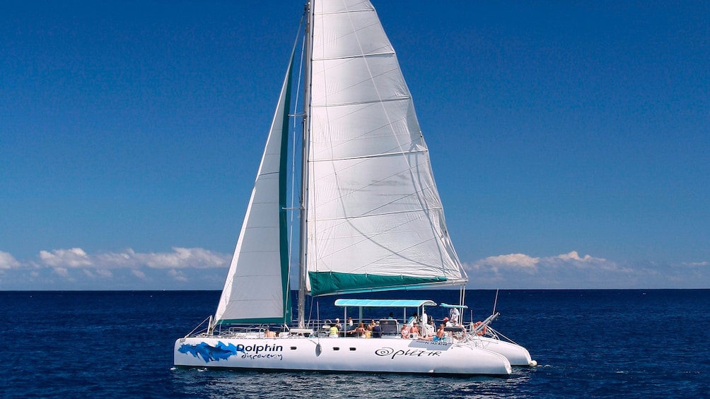 white catamaran setting sail in Mauritius