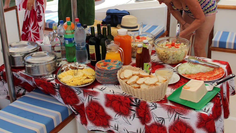 enjoying some refreshments on the cruise to Ile aux Cerfs