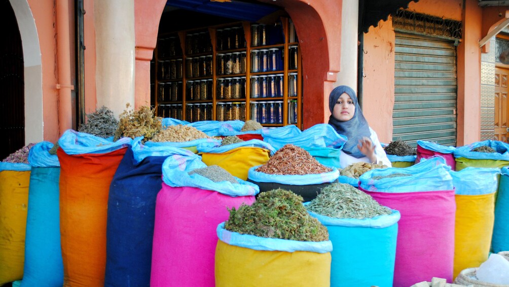 Colorful bags of herbs and spices for sale at a market in Marrakech
