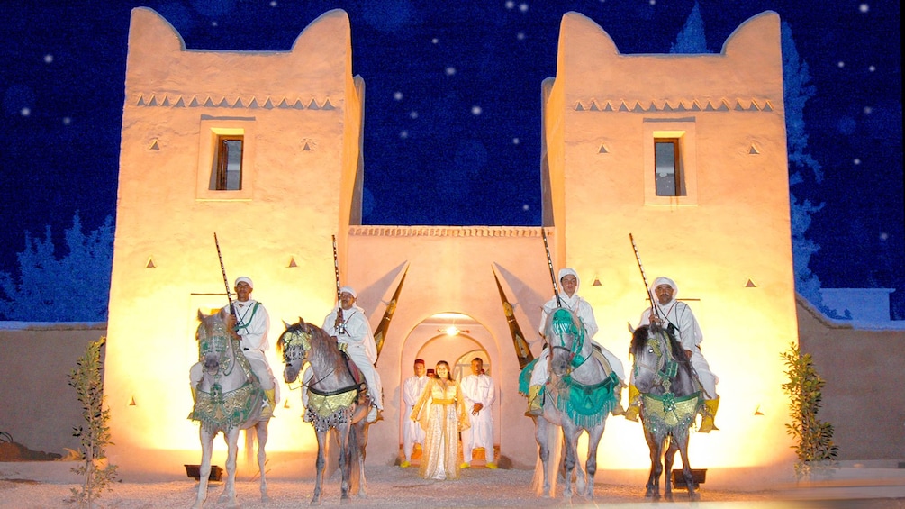 Stallions and performers during a performance in Agadir