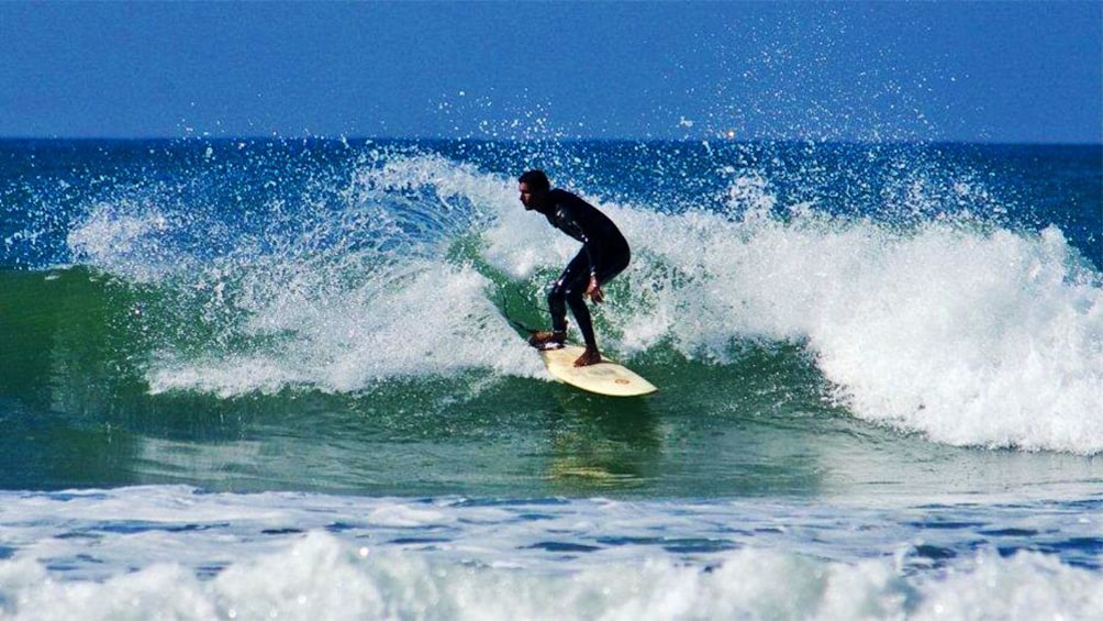 Surfing man in the water in Agadir