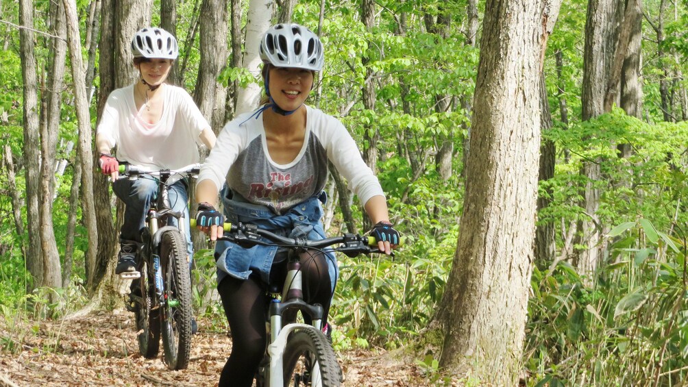 Show item 5 of 10. bicyclists in forest in Tokyo