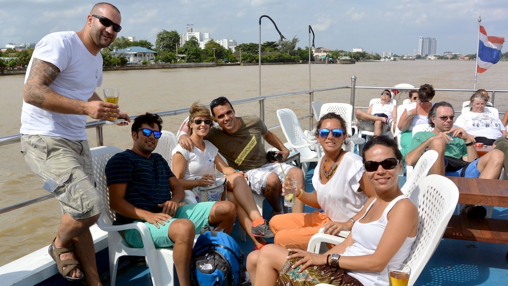 people on a boat in bangkok