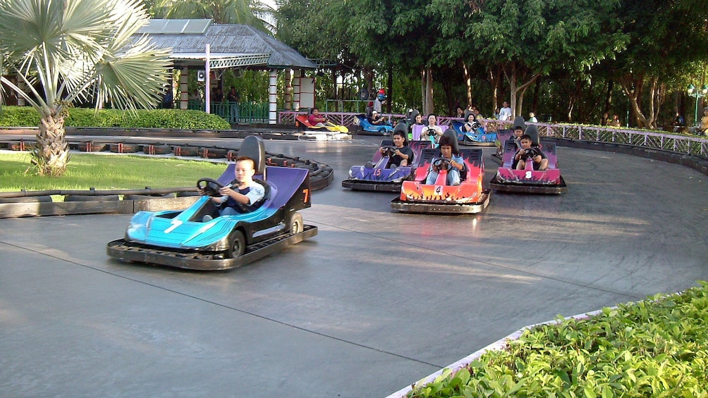 People in go carts in bangkok