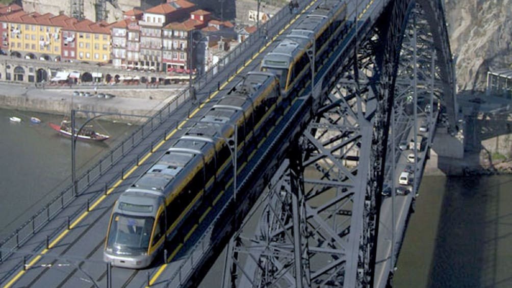 train crossing the bridge in Porto City