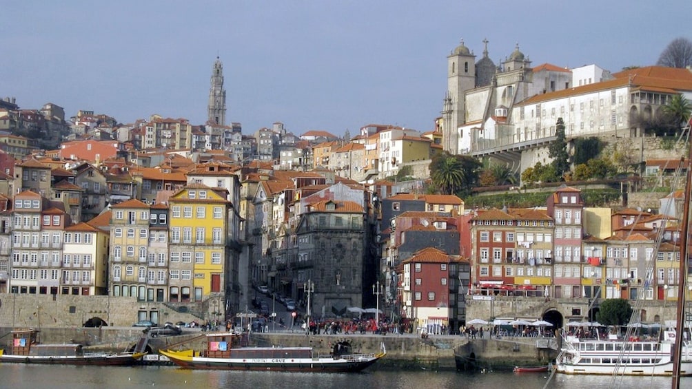 boats docked at the side of the water channels in Porto City