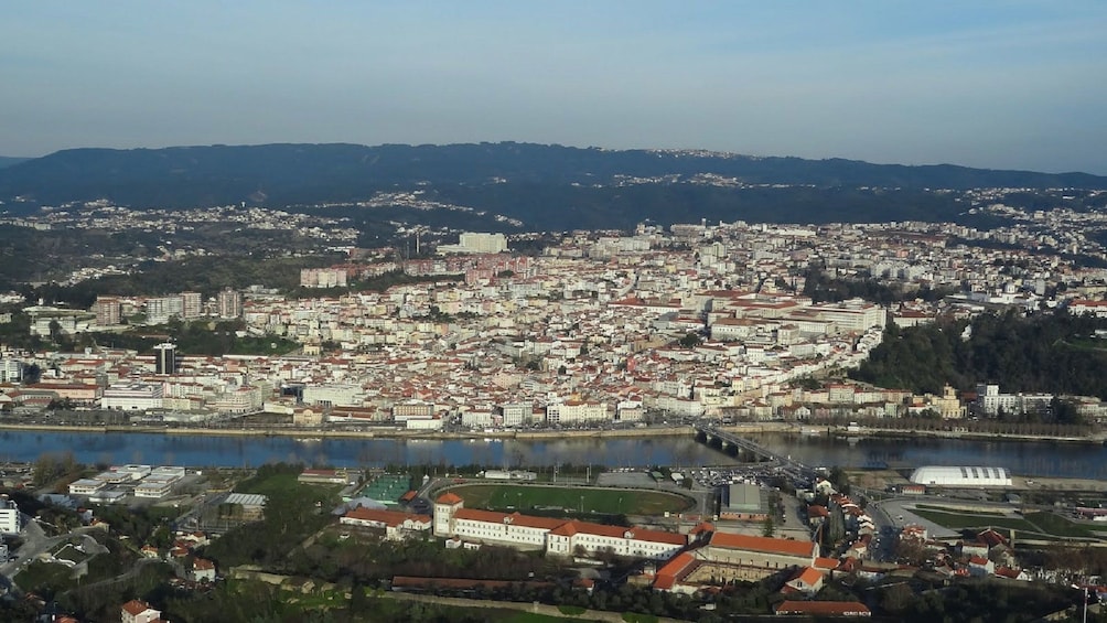 visit the riverfront city of Coimbra in Portugal