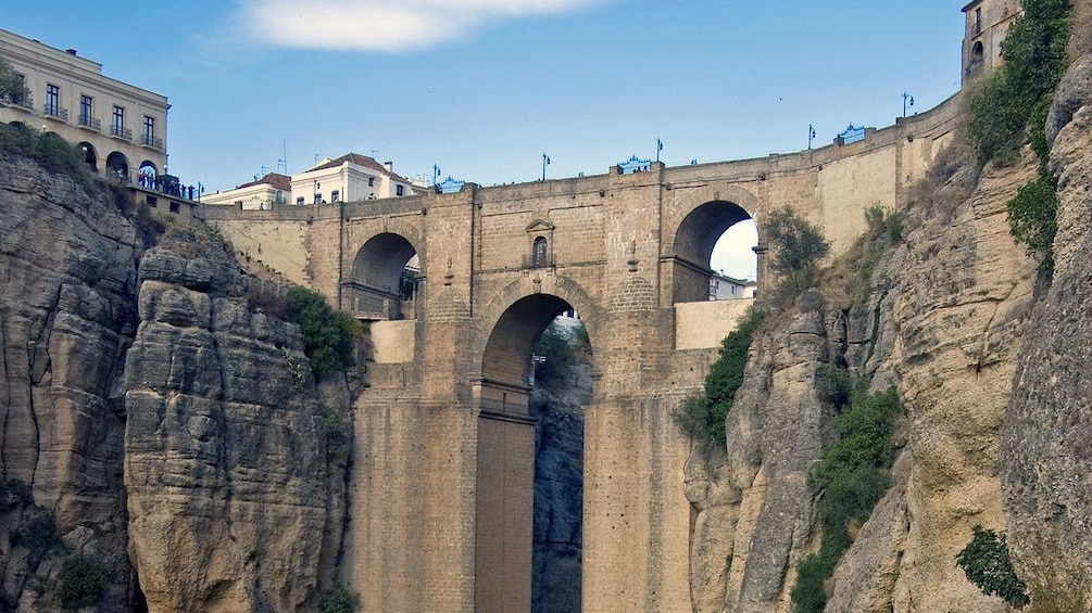 crossing the Puente Nuevo Bridge in the city of Ronda