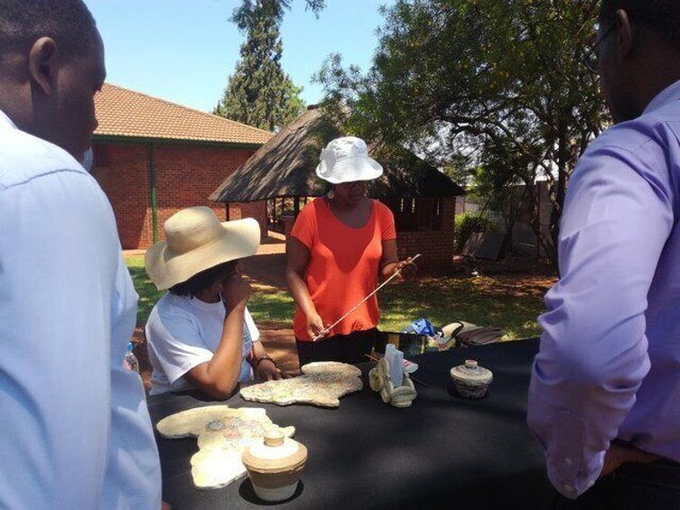 Young female artist demonstrating how she recycles paper to make some amaziing handicraft.