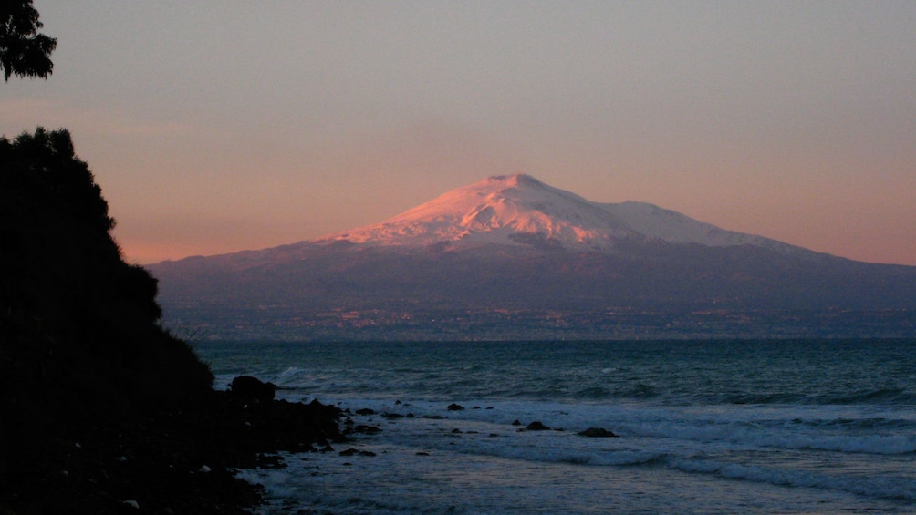 snow capped Mount Etna in Sicily