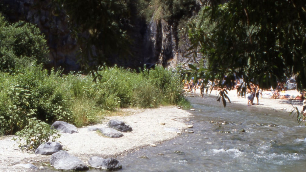 visitors enjoying the sun at Alcantara Gorge in Sicily