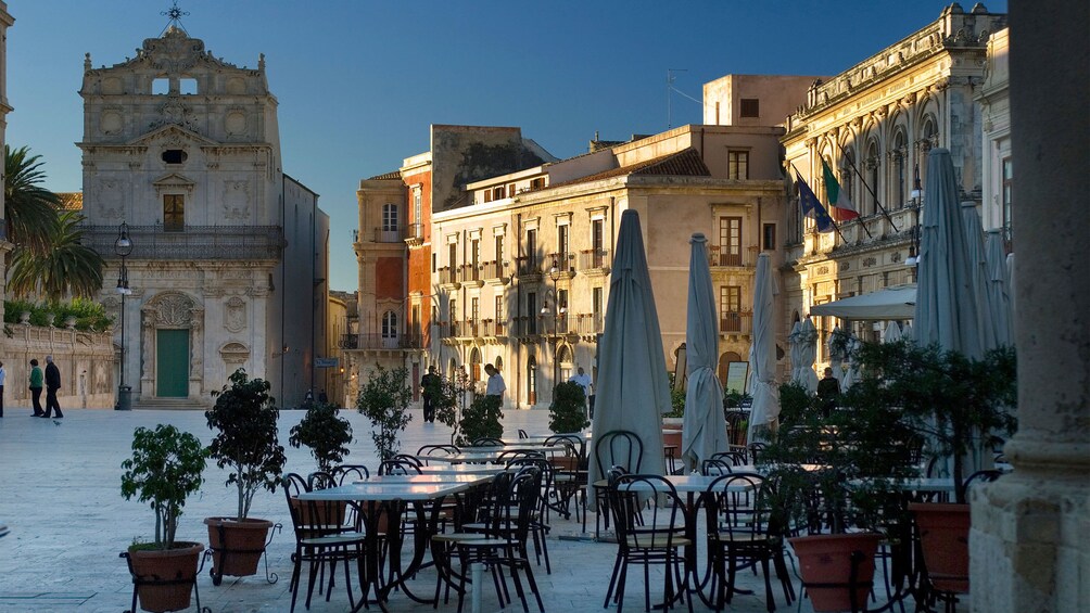 outdoor dining chairs and tables in Sicily
