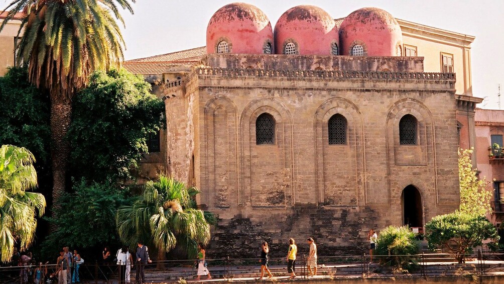 old building with red domed towers in Sicily