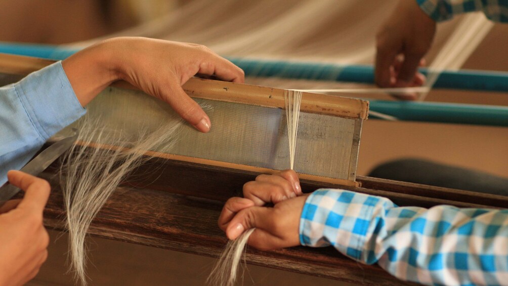 Close view of the silk production process in Siem Reap 