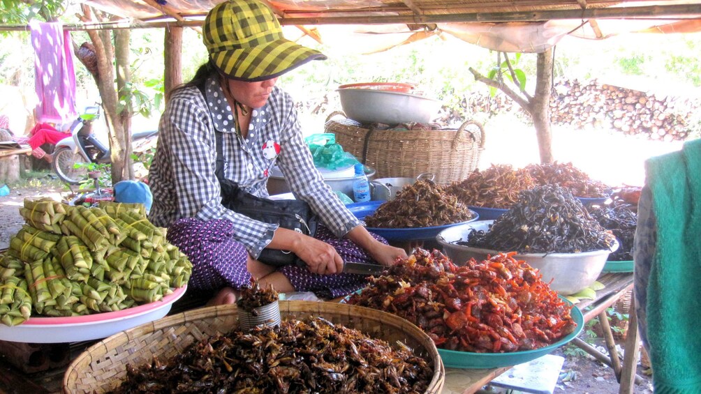 Woman selling goods at a market in Siem Reap 