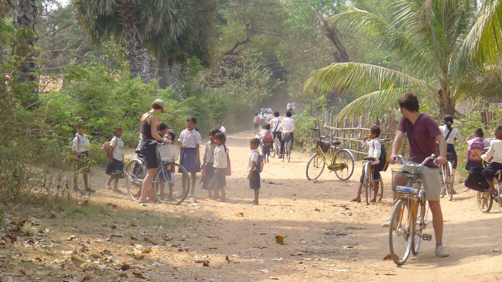 Tourists enjoying a scenic bike tour of gorgeous Siem Reap's countryside