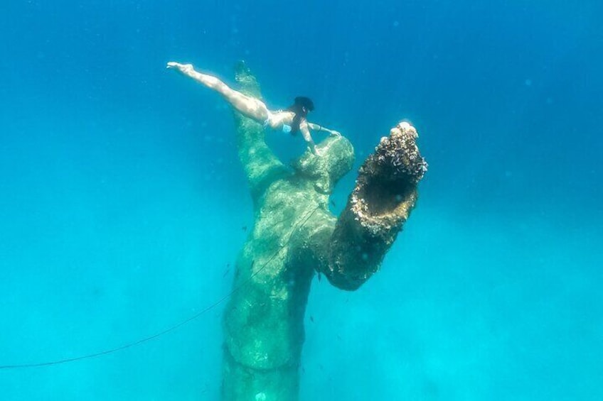 Girl and the Jesus Christ statue