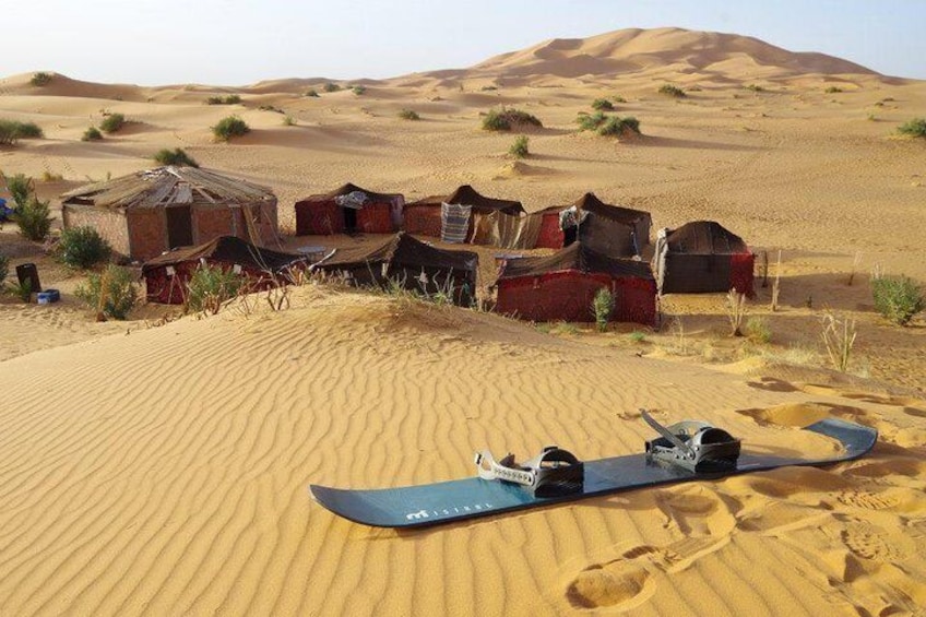 desert camp with sandboard