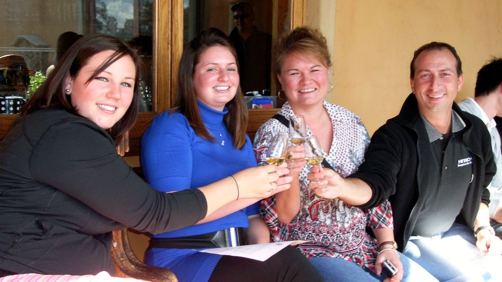 Show item 5 of 8. Family enjoying wine tasting in the Hunter Valley region of Australia