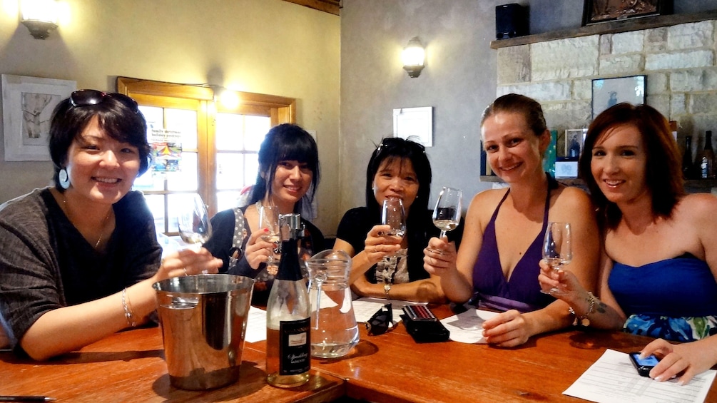 Show item 1 of 8. Group enjoying wine in the Hunter Valley region of Australia