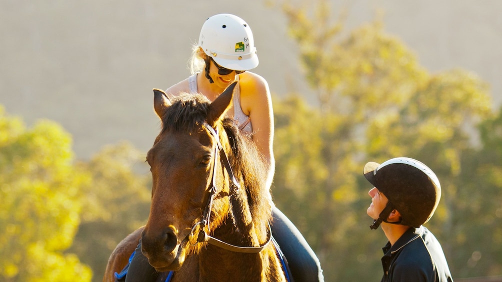 Woman riding a horse at Glenworth Valley in Australia 