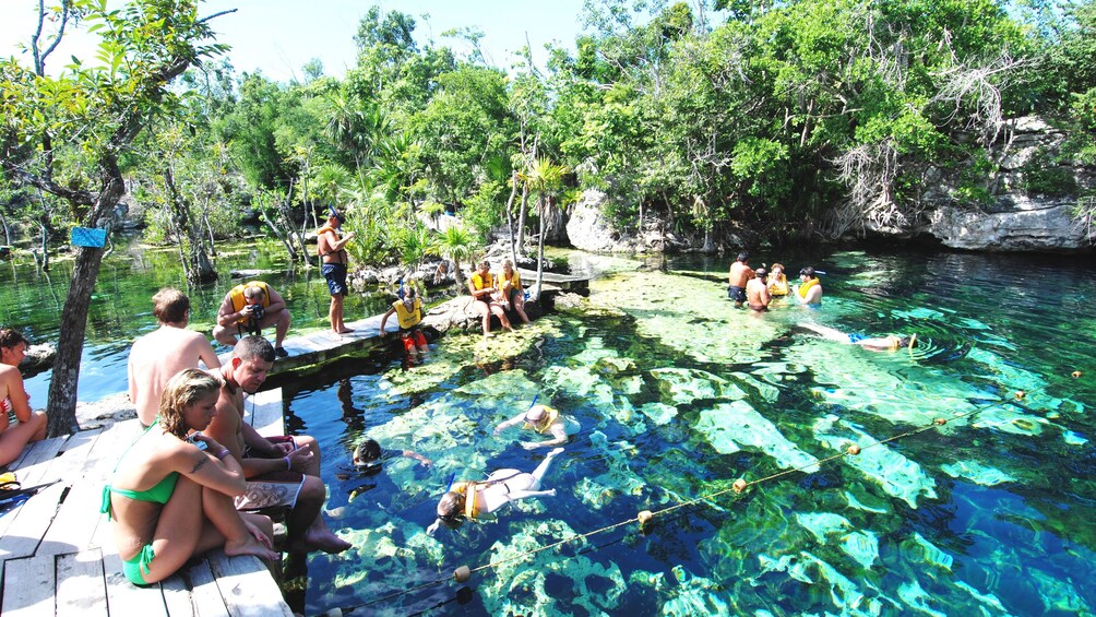 People swimming and snorkeling in a lagoon in Cancun