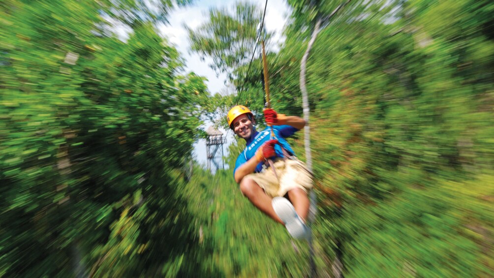 Ziplining through the trees in Cauncun