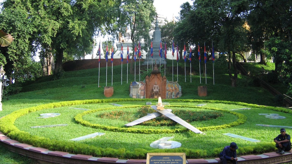 A clock made of shrubbery at a park in Phnom Penh