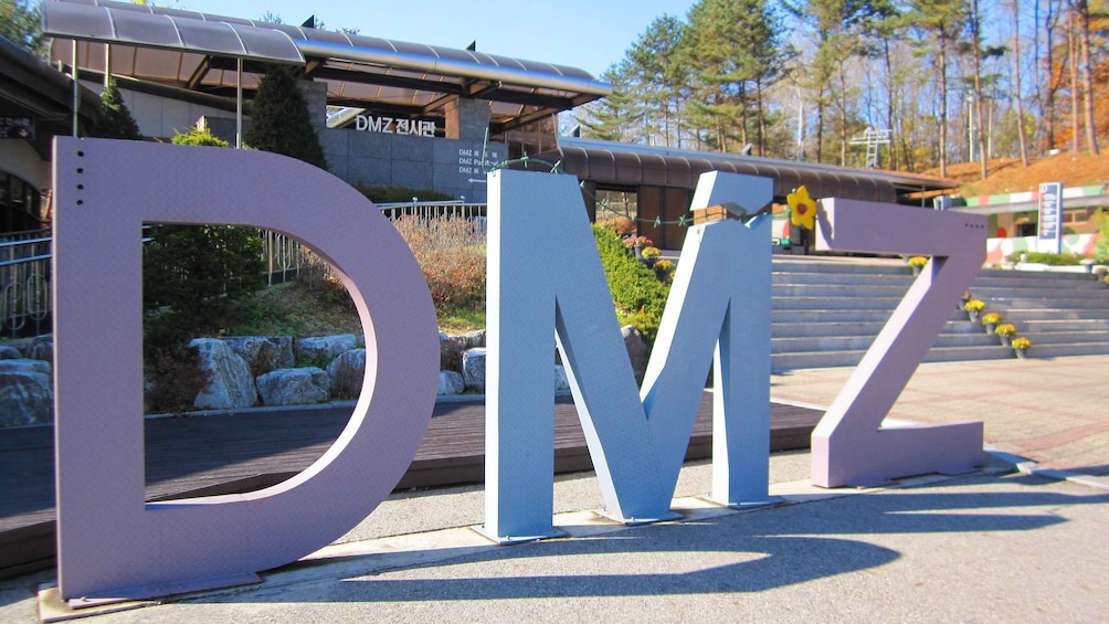 Show item 2 of 5. Demilitarized Zone Tour sign in Seoul