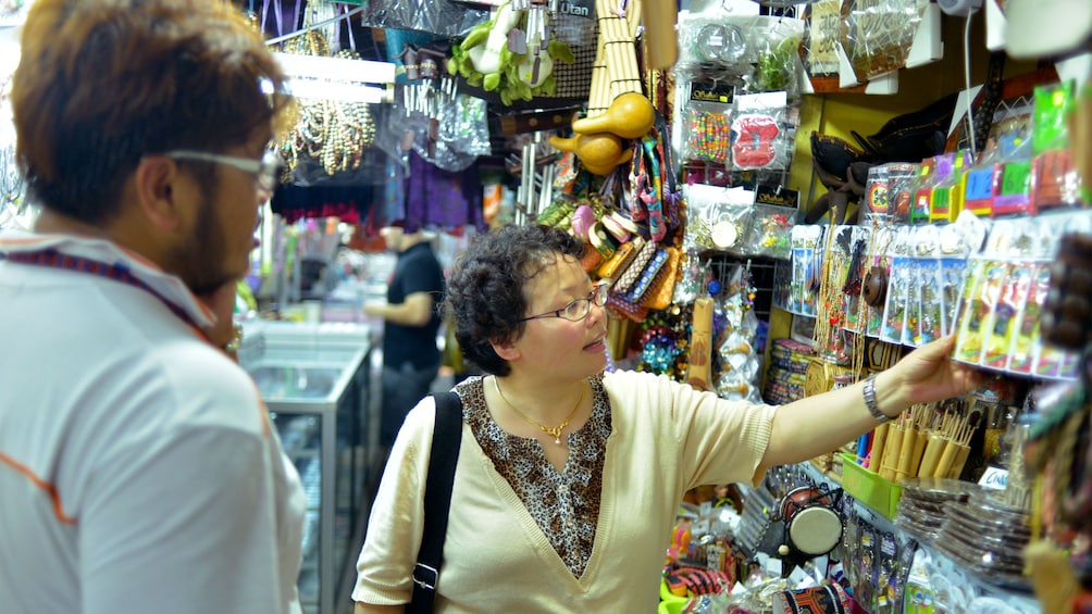 Show item 3 of 5. Woman shopping in Kota Kinabalu