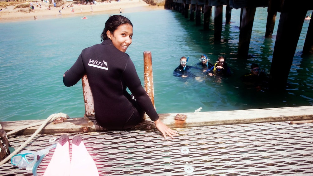 A snorkeler getting into the water at Mornington Peninsula