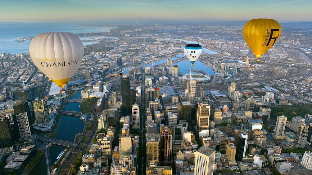 Hot air balloons flying over the city of Melbourne