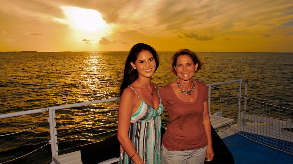 Family enjoying the sunset on the sailboat in Key West