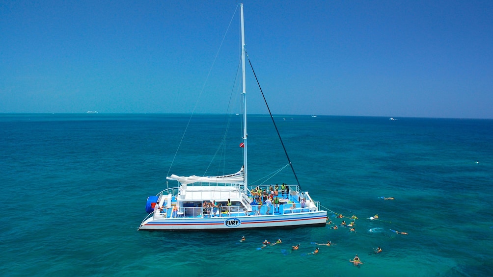 Snorkelers swim around the boat in Key West