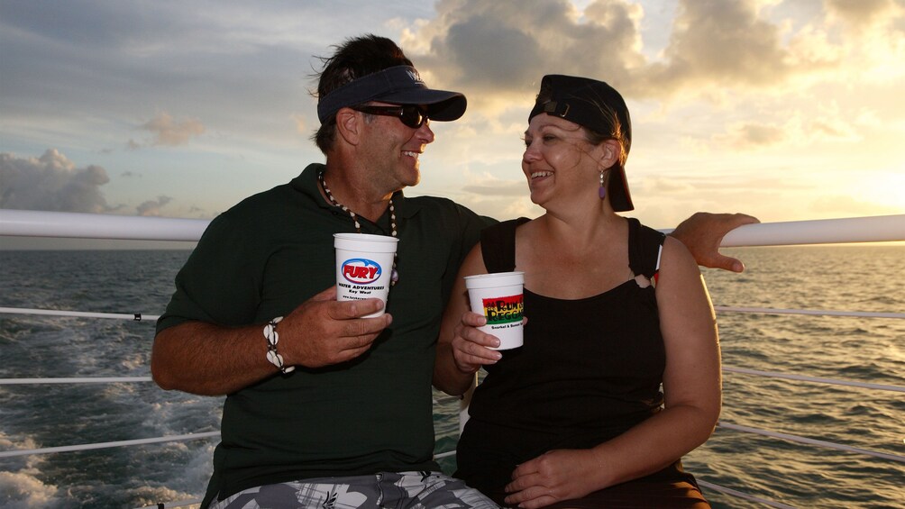 Couple enjoying rum in the sunset at Key West