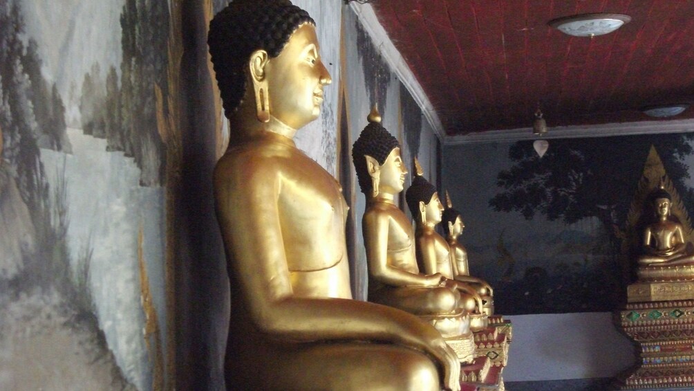 Row of golden statues in Chiang Mai