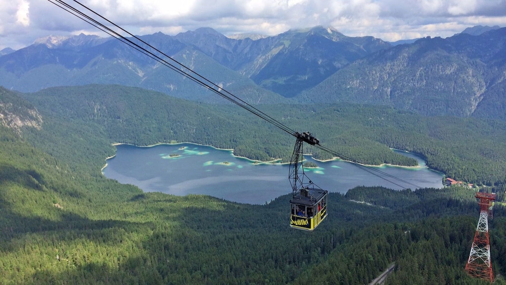Show item 3 of 5. Gondola overlooking the alps in Germany