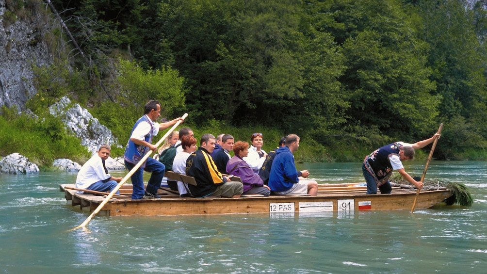 Close view of guests enjoying a wooden raft trip down the Dunajec River in Poland 