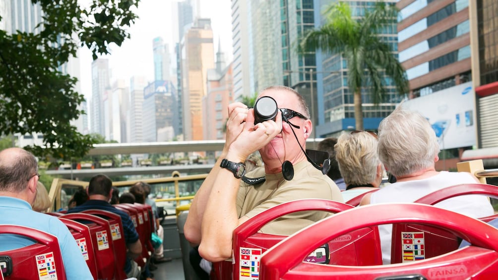 Taking photos from the top deck of the bus in Hong Kong