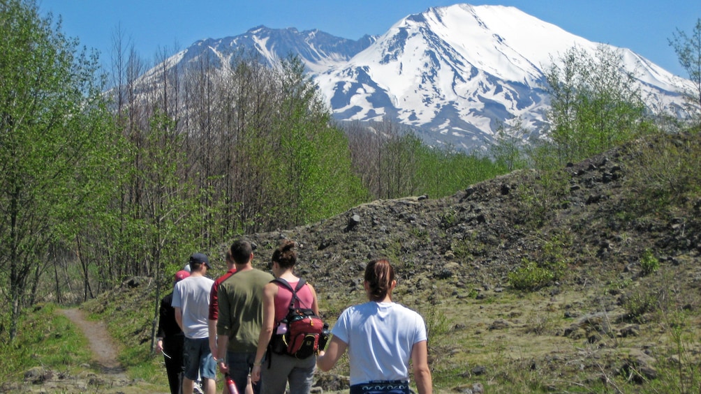 Hikers on a trail at Mount saint helens national volcanic monument in Washington