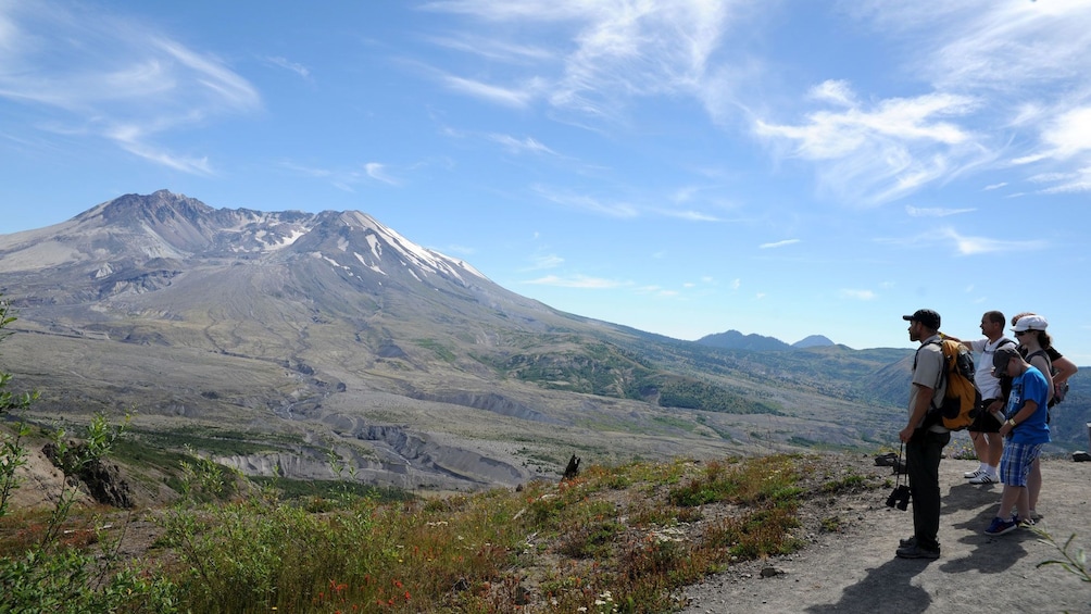 Hiker group looking at Mount saint helens national volcanic monument in Washington 