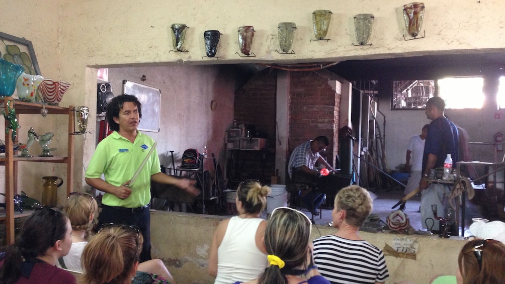 tour guide showing group people working in Los Cabos