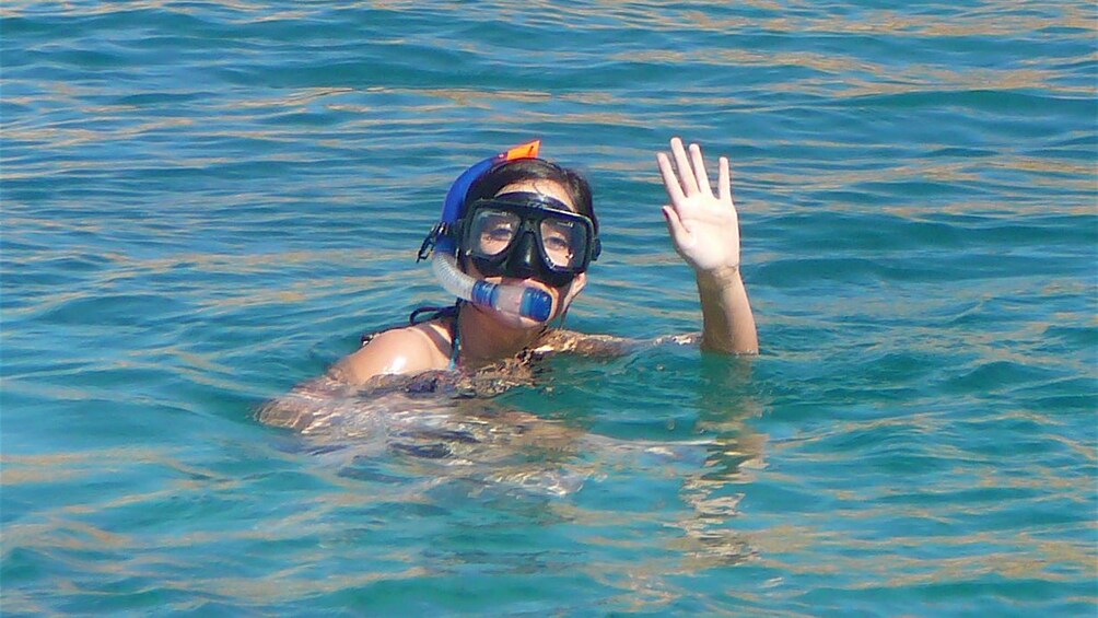 Show item 1 of 10. woman in snorkeling gear in Los Cabos