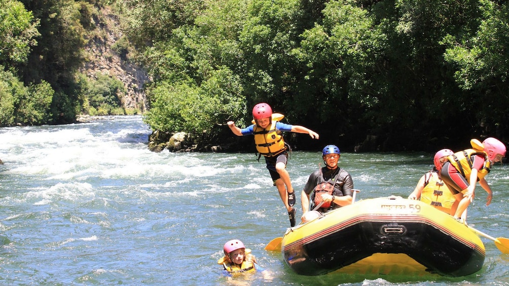 Show item 5 of 5. rafters jump into calmer waters in New Zealand