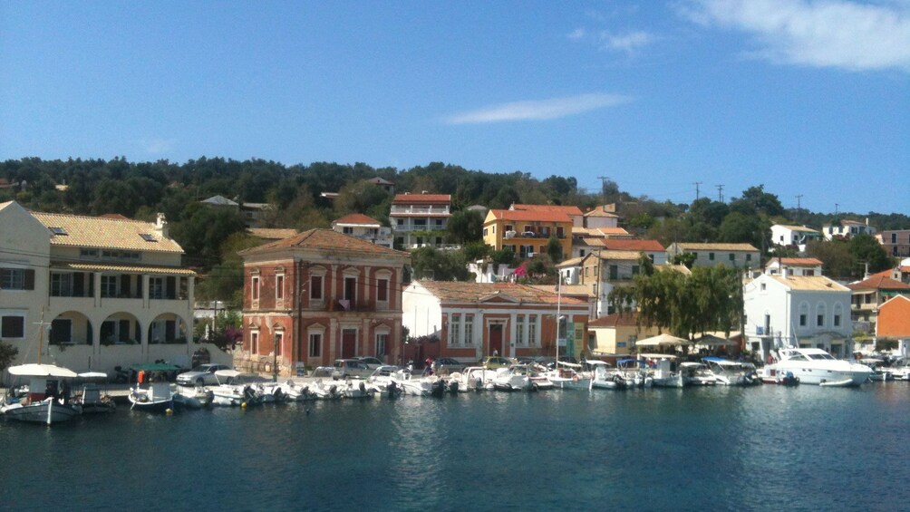 Row of boats along walkway in Corfu Island