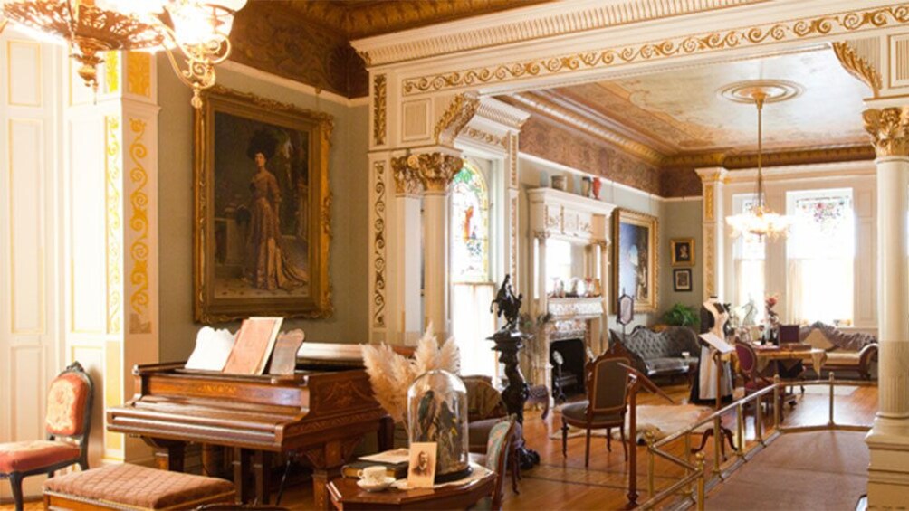 Piano and sitting room inside Craigdarroch Castle in Victoria