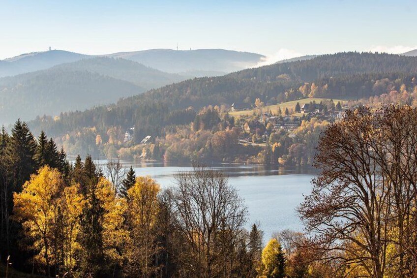 Wooded hills dominate the horizon next to Titisee Lake in the Black Forest, Germany.