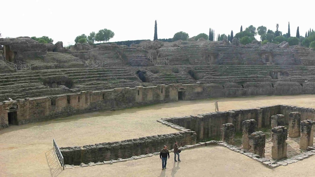 Tourists exploring on the  Italica Guided Half-Day Tour in Seville 