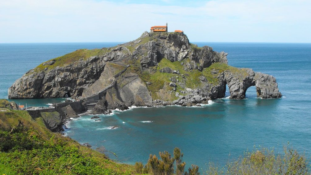 Rocky formation with a church on the Basque coast