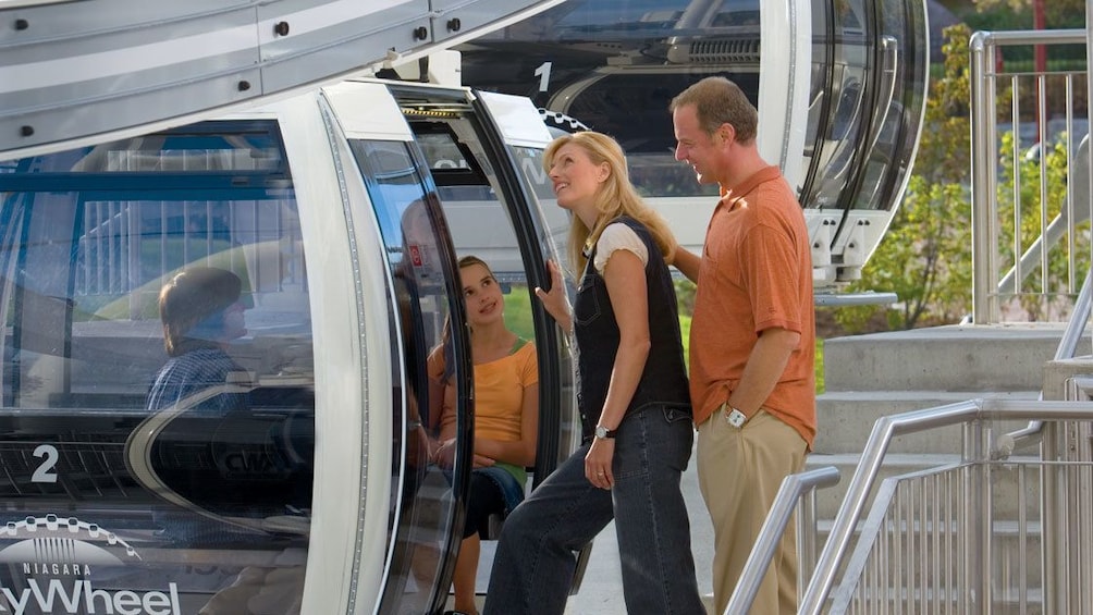 Show item 3 of 5. Family entering the Niagara SkyWheel at Niagara Falls